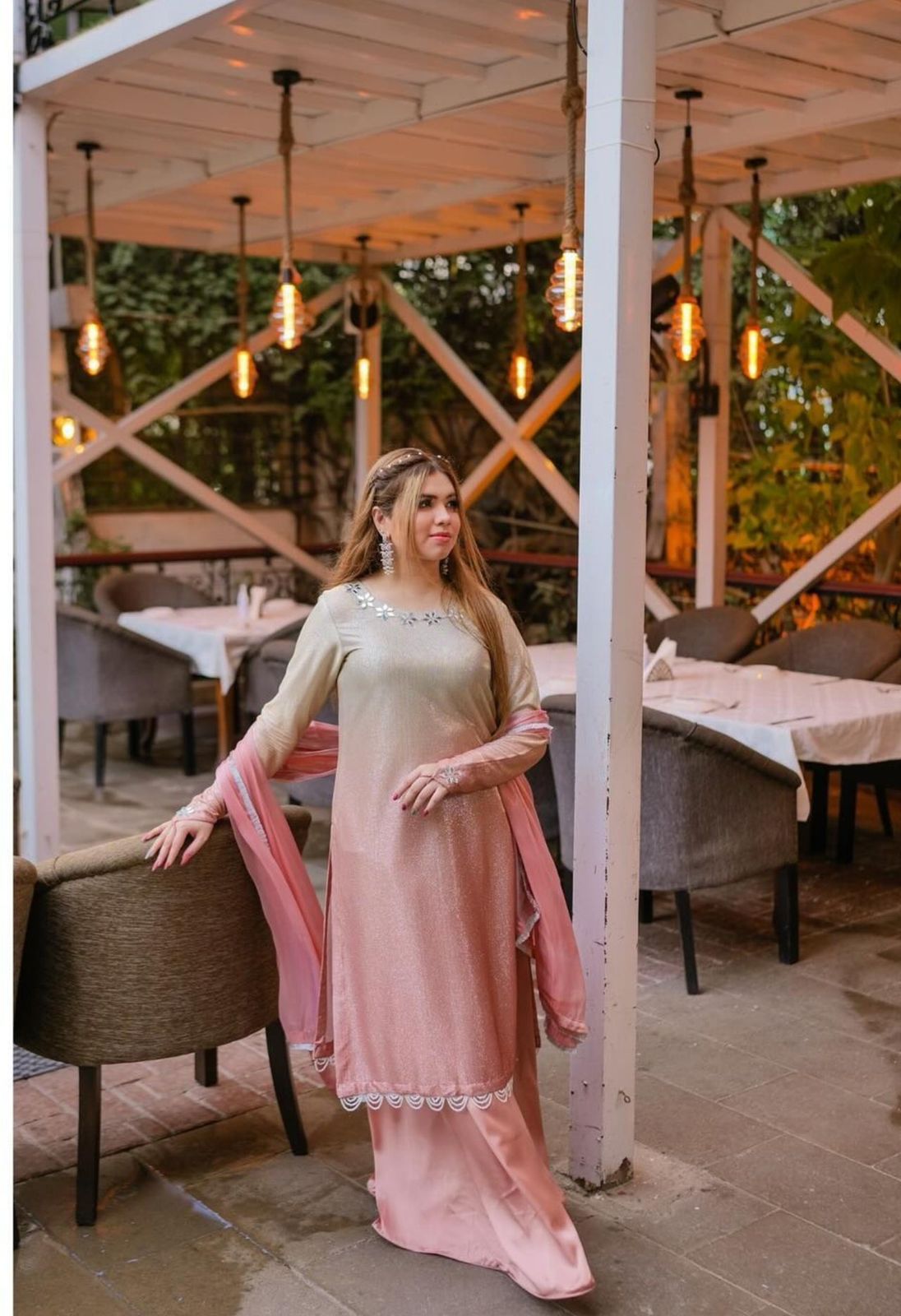 Beige long ethnic dress with pink flowing dupatta and lace-trim hem