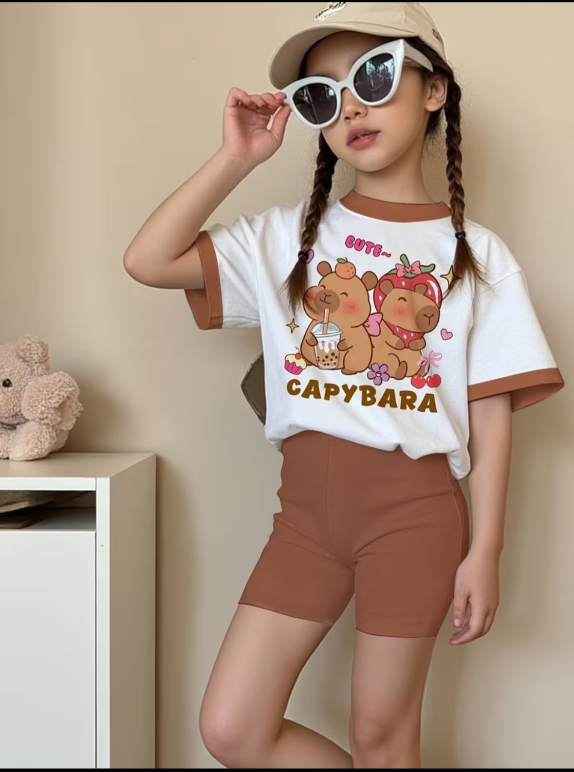 Kids capybara cartoon T-shirt and brown shorts, worn with sunglasses