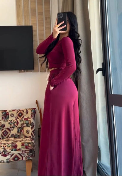 Maroon long-sleeve crop top and high-waist wide-leg loungewear pants, side view