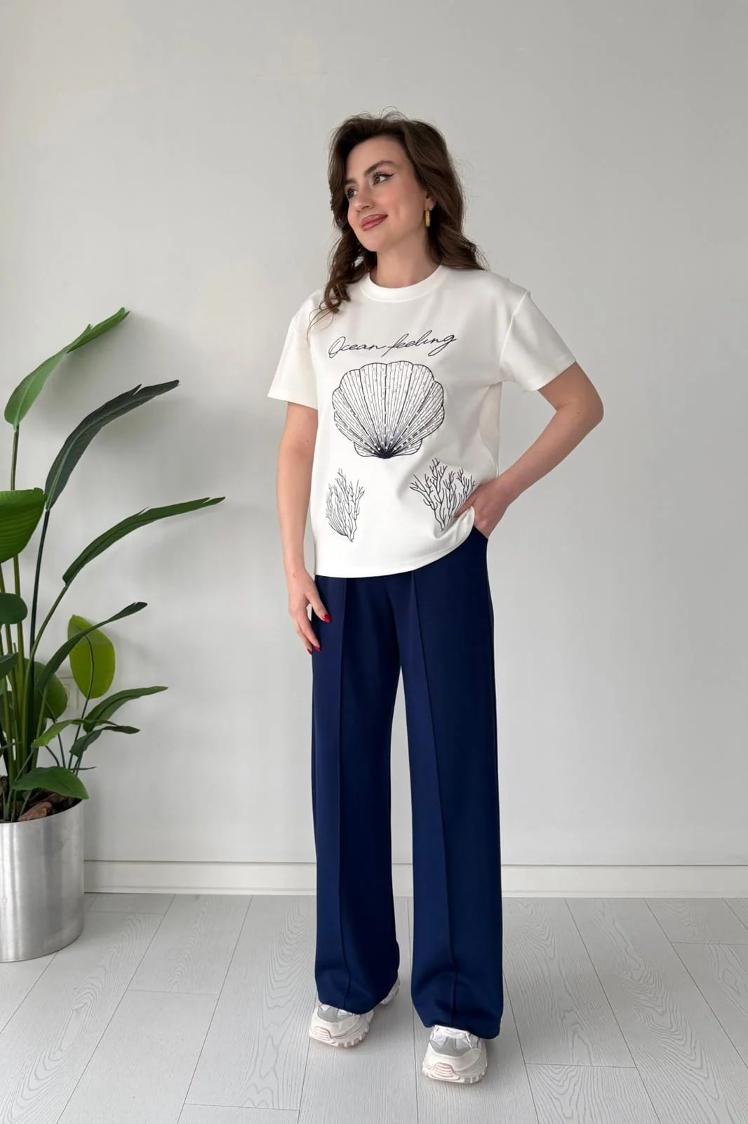 Printed cord set with white shell graphic T-shirt and navy blue wide-leg pants