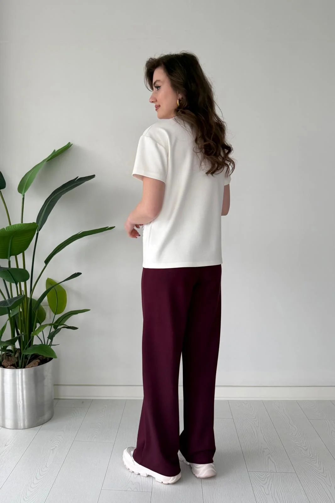 Printed cord set with white shell graphic T-shirt and maroon wide-leg pants