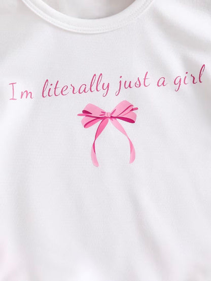 White T-shirt with pink text and bow graphic at center