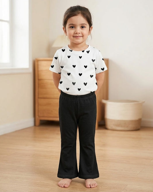 Heart print two-piece set: white shirt with black hearts, black pants