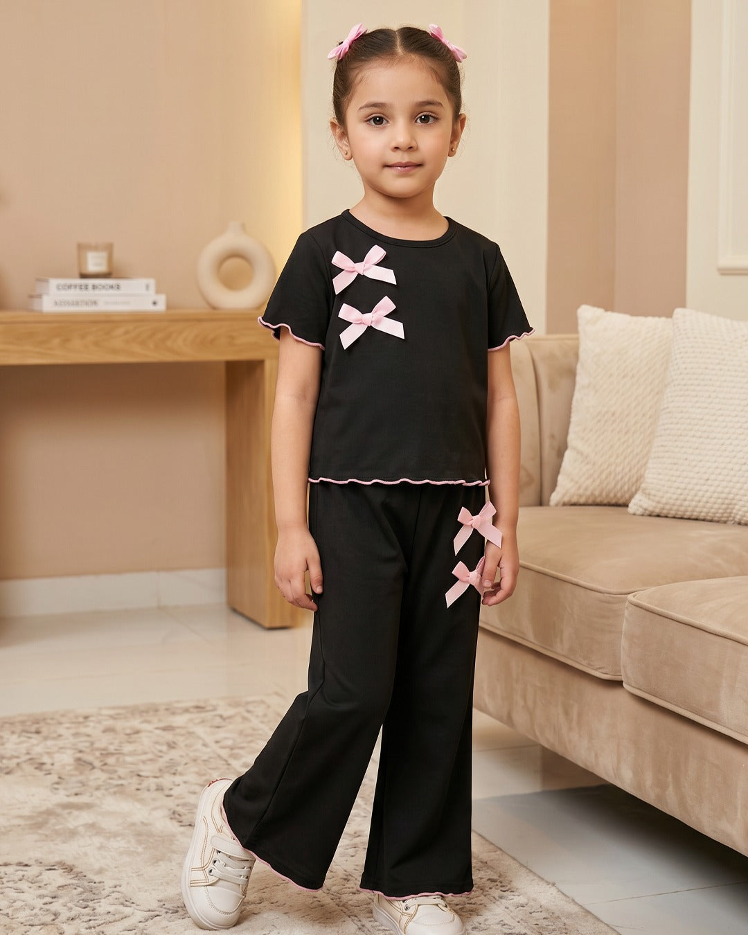 Black baby doll bow outfit set with pink bows, short-sleeve top and wide-leg pants