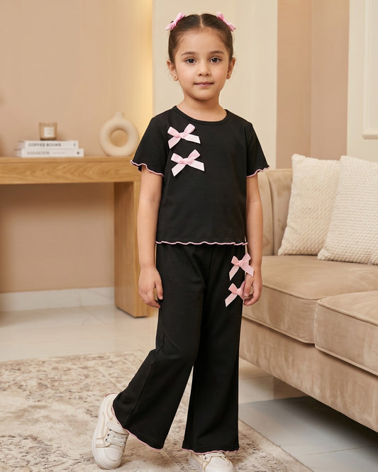 Black baby doll bow outfit set with pink bows, short-sleeve top and wide-leg pants