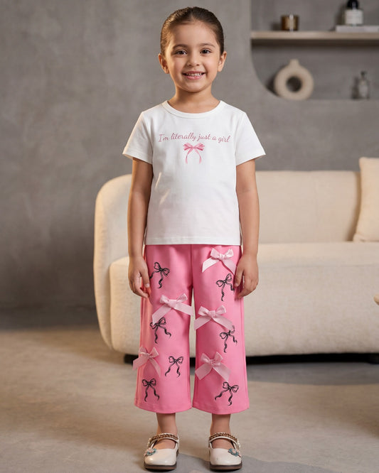 Girls bow set: white graphic T-shirt with pink bow-print shorts and bow tie