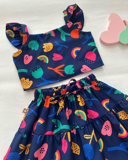 Navy tiered gathered skirt with colorful fruit, rainbows, and animals print