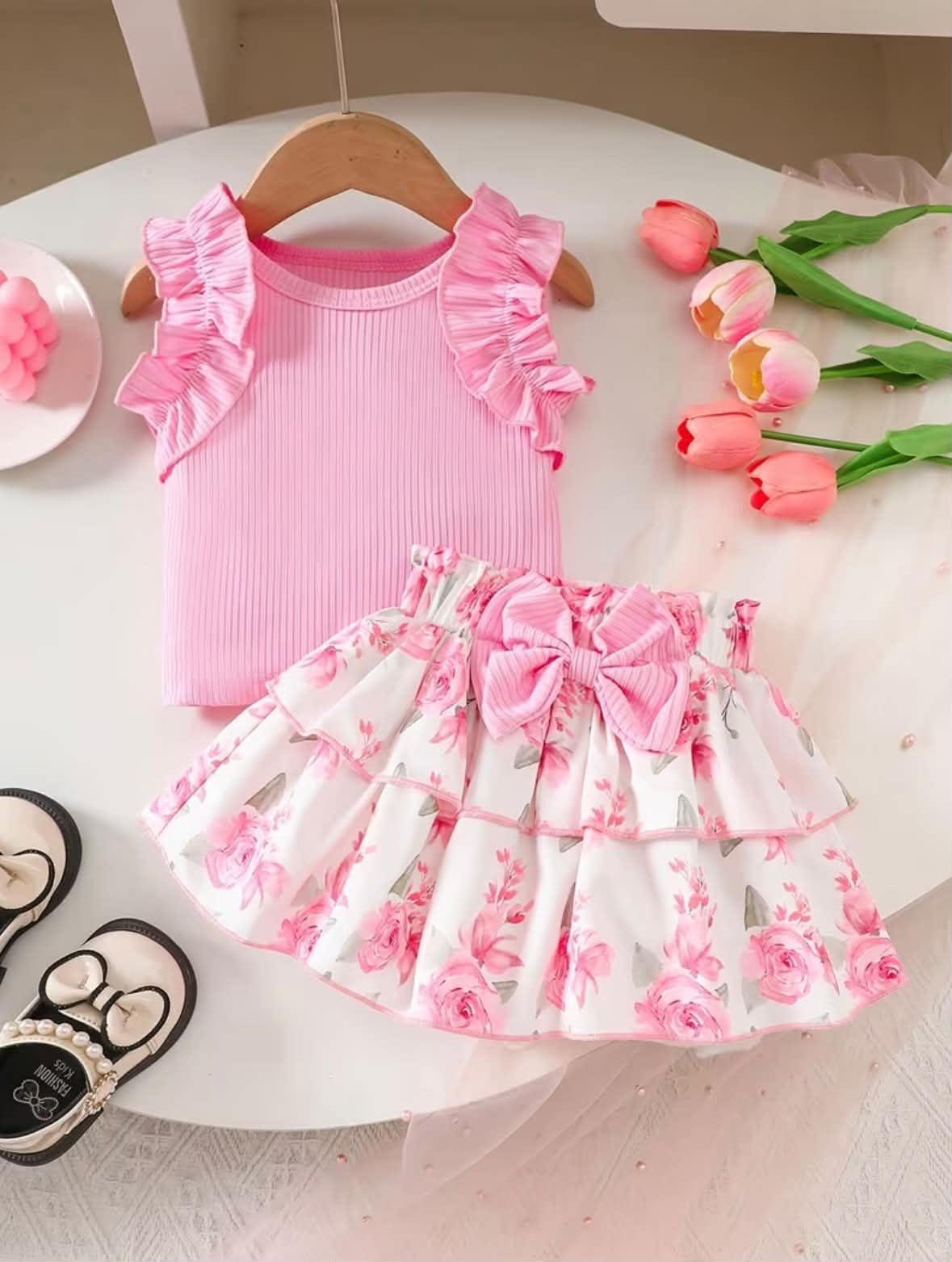 Girls' pink sleeveless dress set with ruffled shoulders and floral tiered skirt