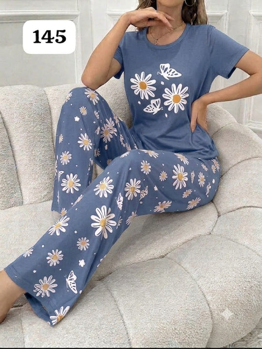 Blue short-sleeve pajama set with daisy and butterfly print on pants and T-shirt.