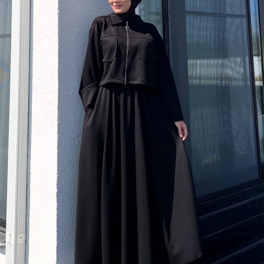 Black long maxi dress with zip-up upper fleece jacket, front pockets and high collar