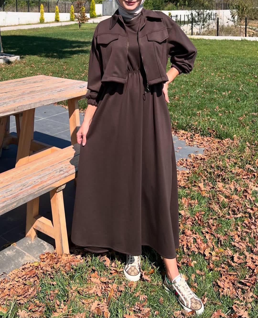 Dark brown long maxi dress with zip-up upper fleece jacket, chest pockets and belt tie