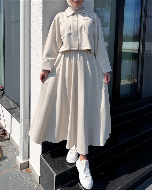 White long maxi dress with zip-up upper fleece jacket, chest pockets and cinched waist