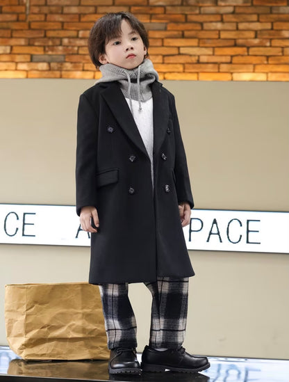 Vintage black trench coat with flap pockets and double-breasted closure, front view