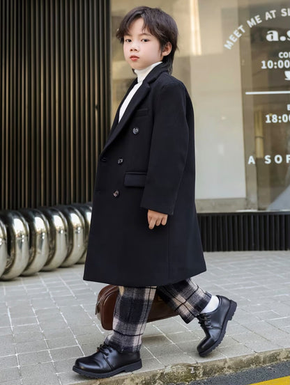 Vintage black trench coat with double-breasted buttons and long sleeves, front view