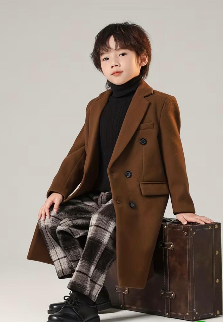Brown double-breasted trench coat with chest flap pocket and plaid pants underneath