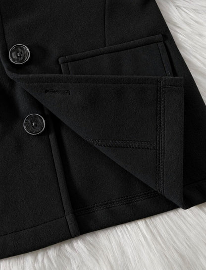 Black hooded coat sleeve cuff with round buttons and stitched flap pocket