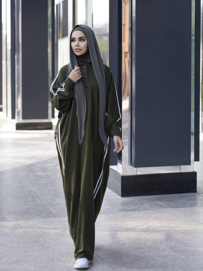 Olive abaya dress with white side stripe sleeves, button front, paired with black hijab
