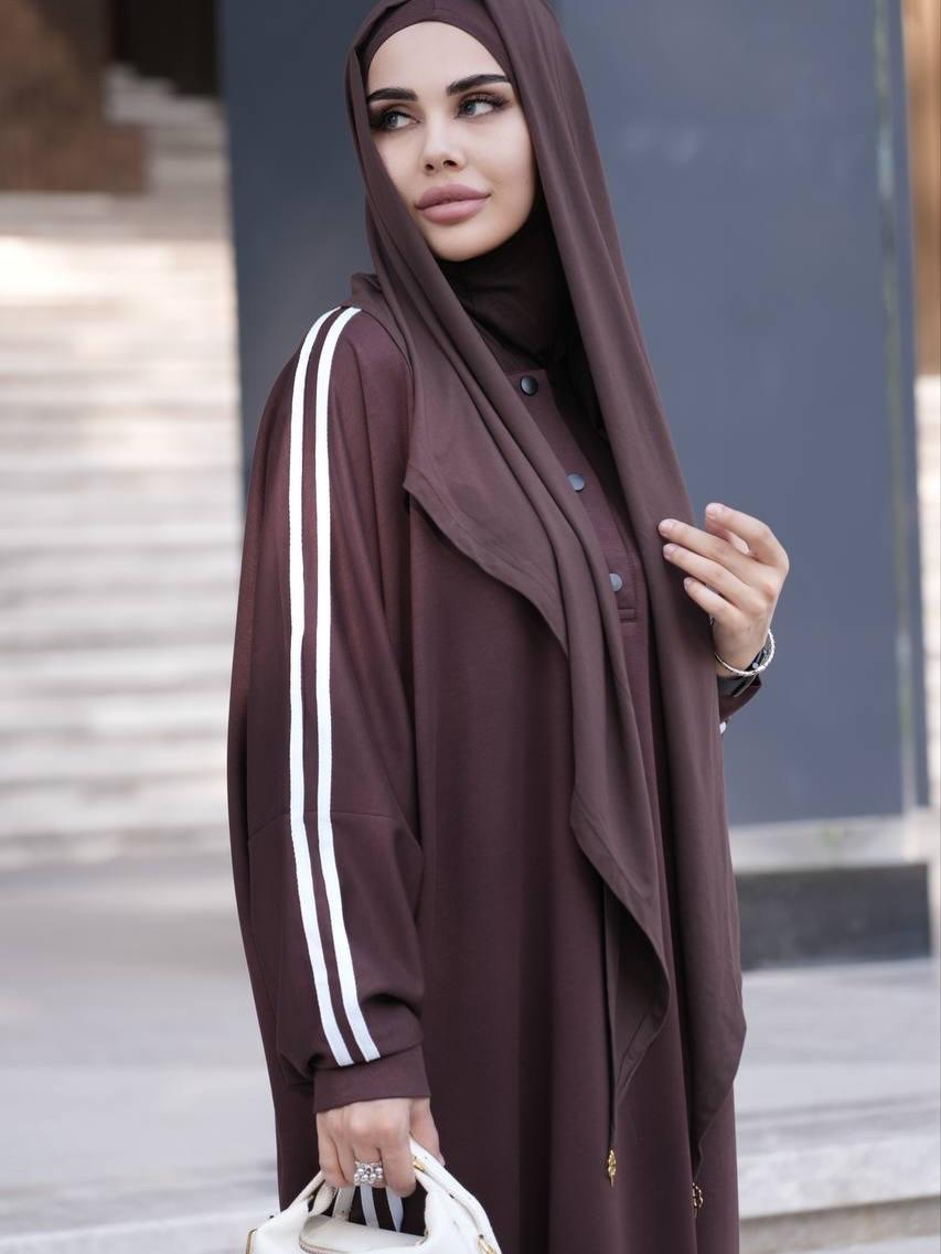 Brown abaya dress with white stripe sleeves, button front, paired with brown hijab