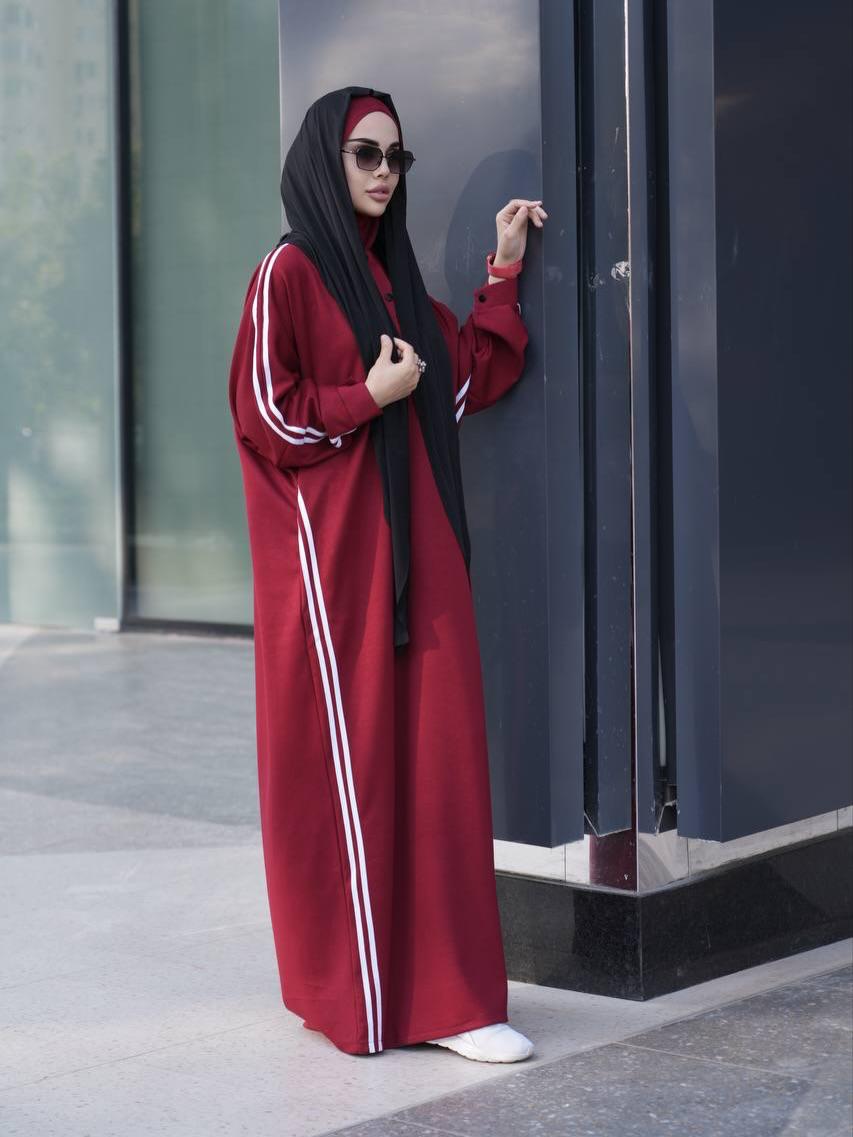 Maroon abaya dress with white stripe sleeves, button front, paired with black hijab
