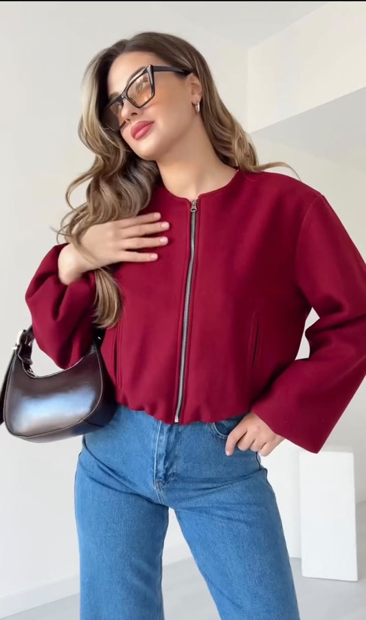 Burgundy cropped zip-up jacket with long sleeves and front zipper