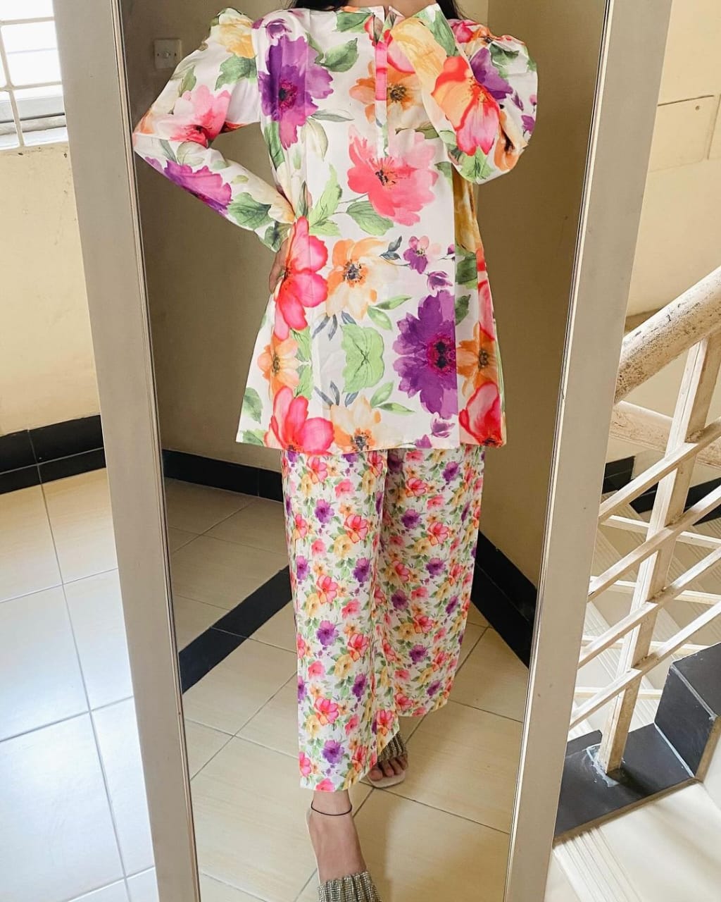 Floral co-ord set with long-sleeve top and ankle-length pants, vibrant flower print