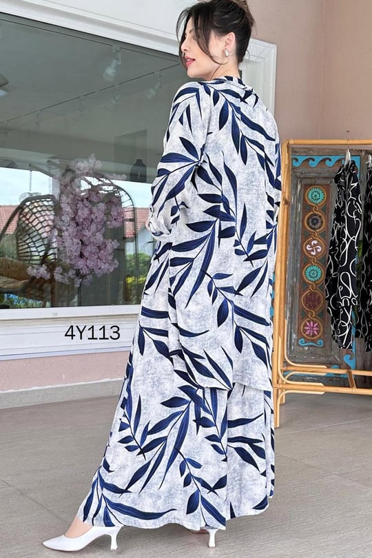 Back view of leaf-print co-ord set, long skirt with gathered navy leaf pattern