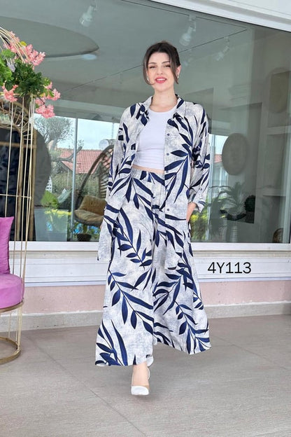 Leaf-print co-ord set with long skirt and buttoned top, navy leaf pattern on light fabric