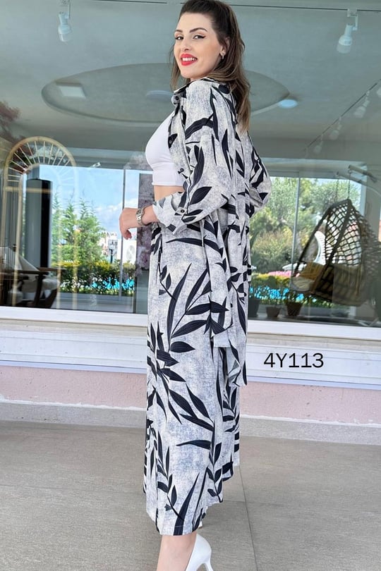 Leaf-print co-ord set with long skirt and buttoned top, blue and black on light background