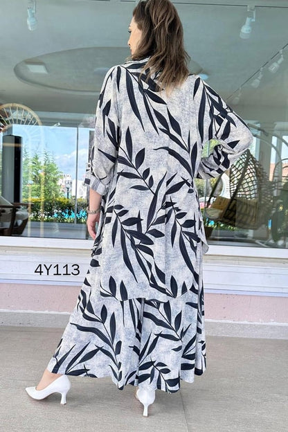Back view of leaf-print co-ord set, long skirt with navy leaves on light fabric