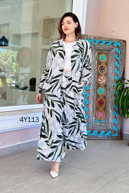 Leaf-print co-ord set with long skirt and buttoned top, navy leaves on light gray background