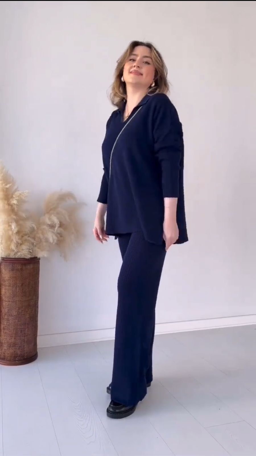 Navy two-piece V-neck top and matching wide-leg pants set
