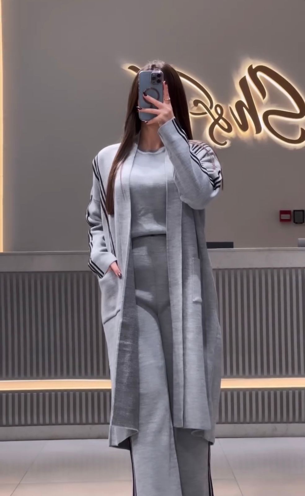 3-piece winter stripe co-ord set in grey: long jacket, top, and matching trousers.