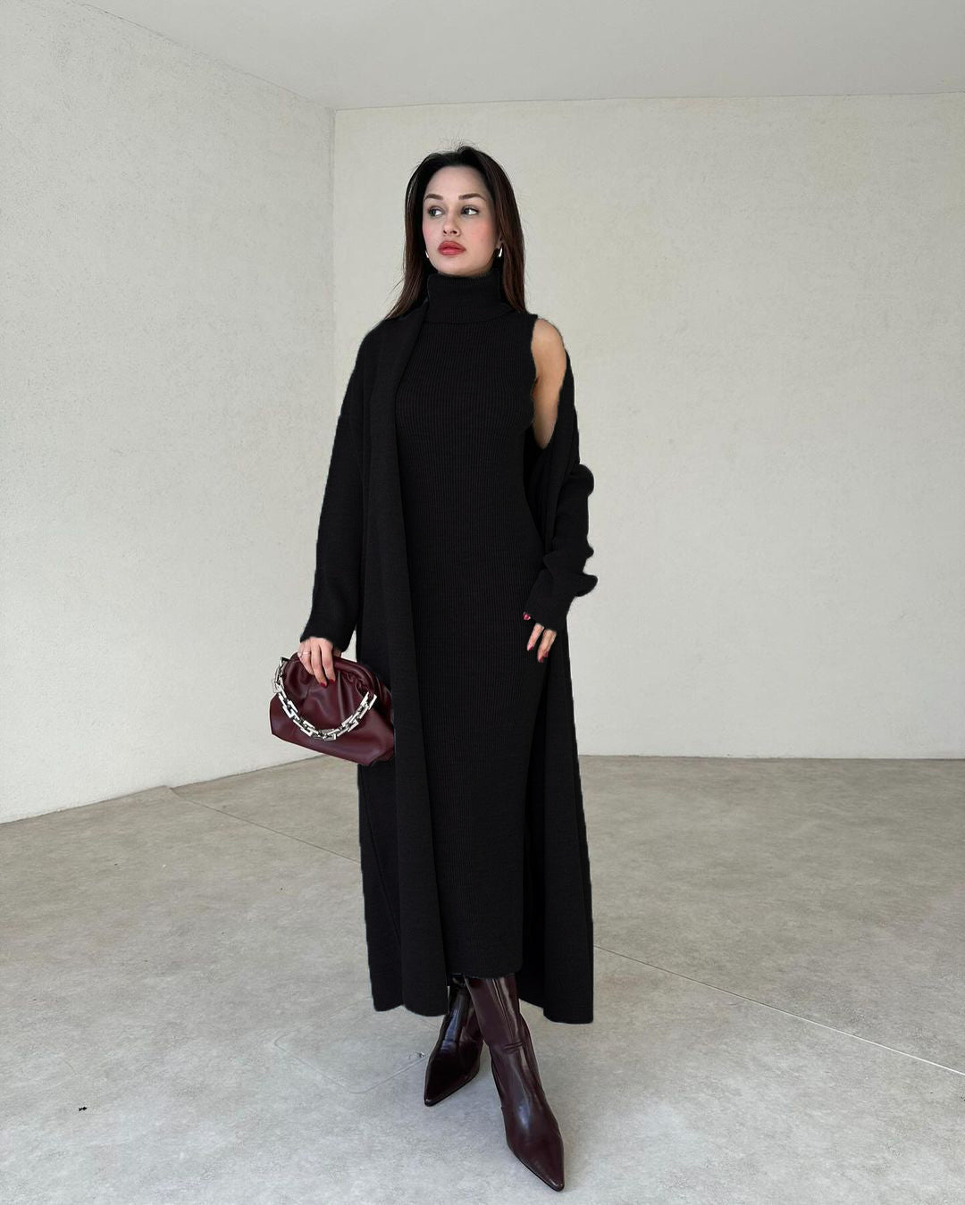 Black two-piece bodycon gown set with draped cold-shoulder outer and fitted sleeveless top