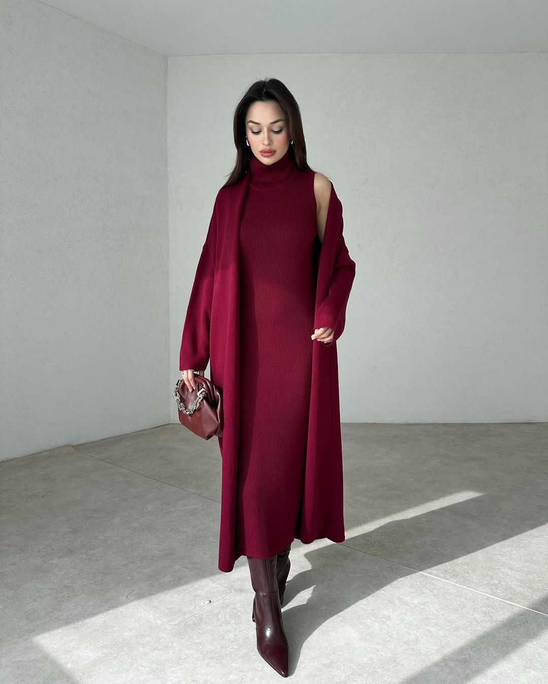 Maroon two-piece bodycon gown set with draped off-shoulder sleeves and fitted dress