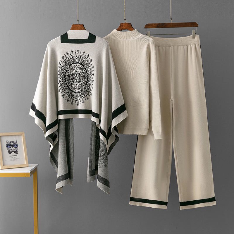 Cami three-piece set: white poncho top, cami, and wide-leg pants with dark green trim
