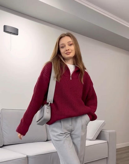 Burgundy drop-shoulder knit sweater with ribbed neckline and long sleeves