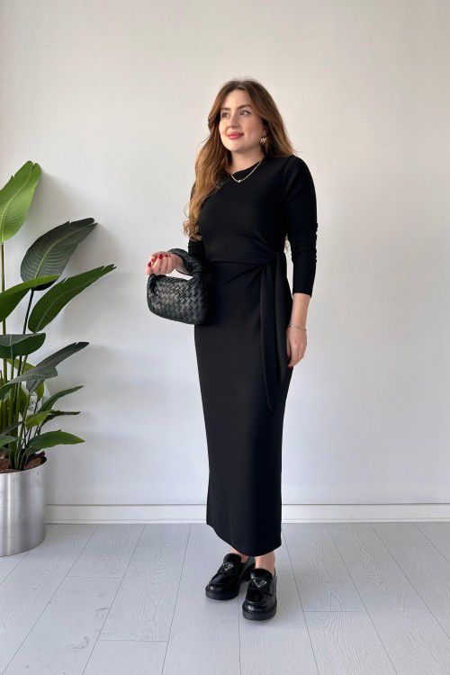 Black modal tie dress with long sleeves, fitted midi silhouette, and waist tie