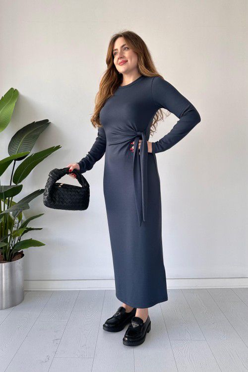 Dark gray modal tie dress with long sleeves, fitted midi silhouette, and waist tie