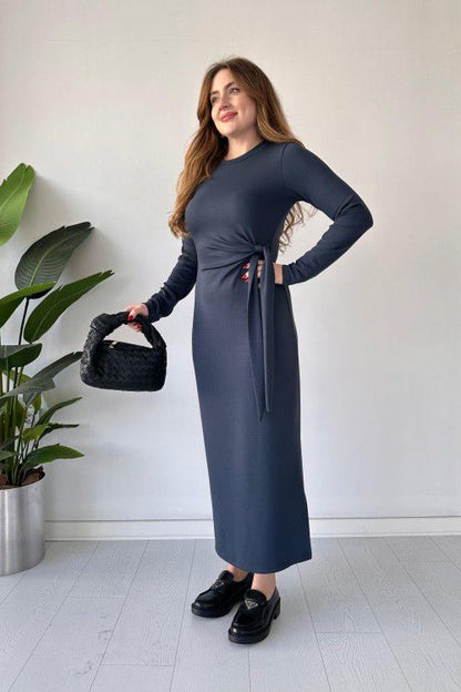 Dark gray modal tie dress with long sleeves, fitted midi silhouette, and waist tie