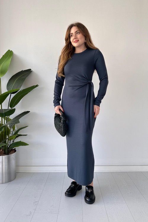 Navy modal tie dress with long sleeves, fitted midi silhouette, and waist tie detail