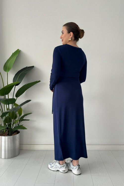 Navy modal tie dress with long sleeves, fitted back, midi length, and waist tie