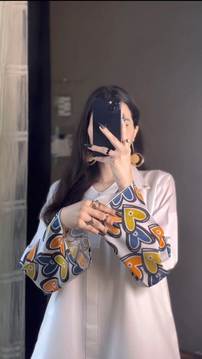 Printed shirt and palazzo set: white top with heart-print cuffs and matching skirt