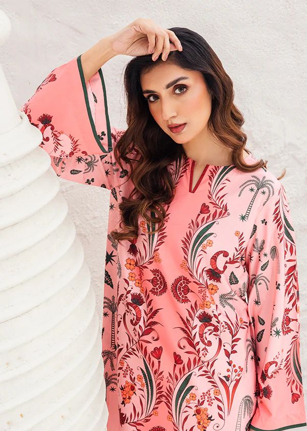 Blush floral printed tunic with long sleeves and detailed trim, close-up