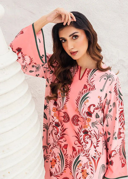 Blush floral printed tunic with long sleeves and detailed trim, close-up
