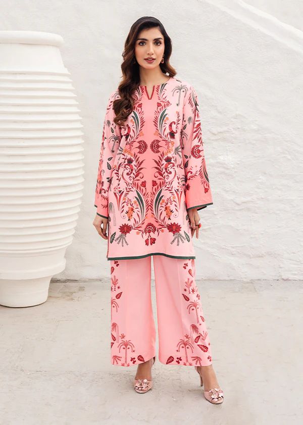 Blush printed tunic with V-neck and button placket, paired with wide-leg pants