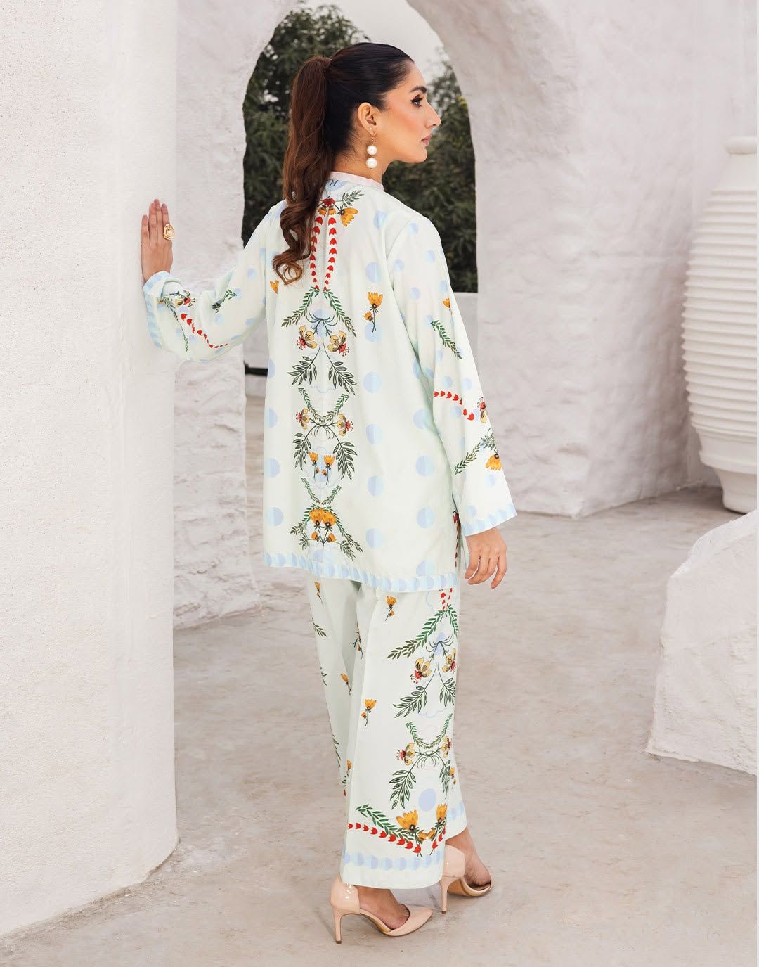 Back view: light blue printed kurta with floral motifs and matching pants