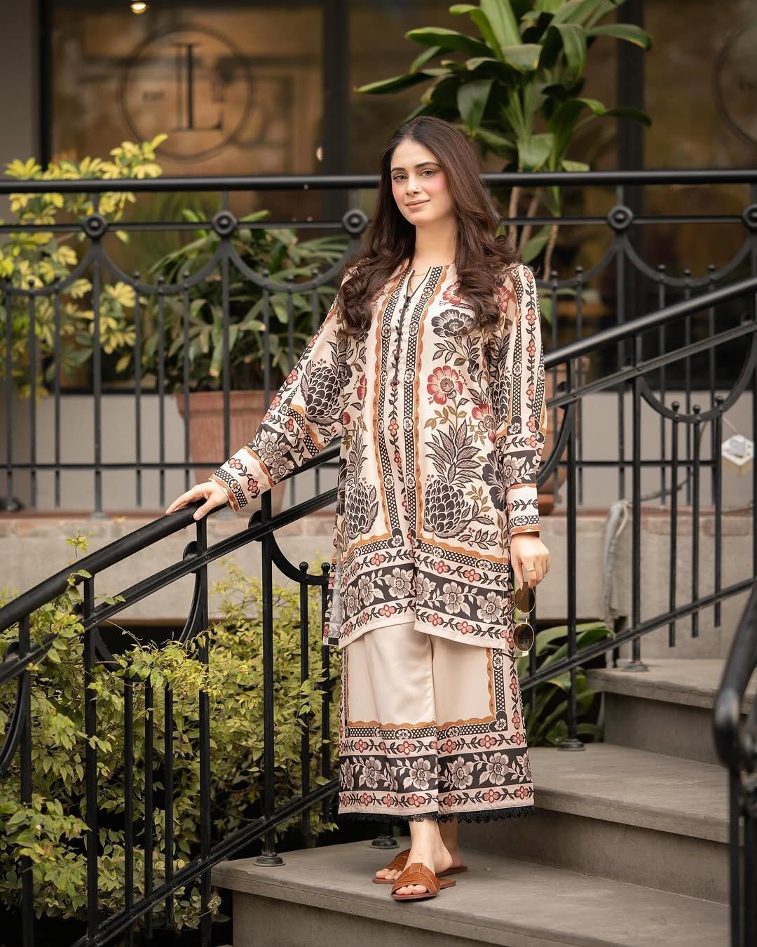 Printed kurta and pants set with vertical panel motifs and decorative border