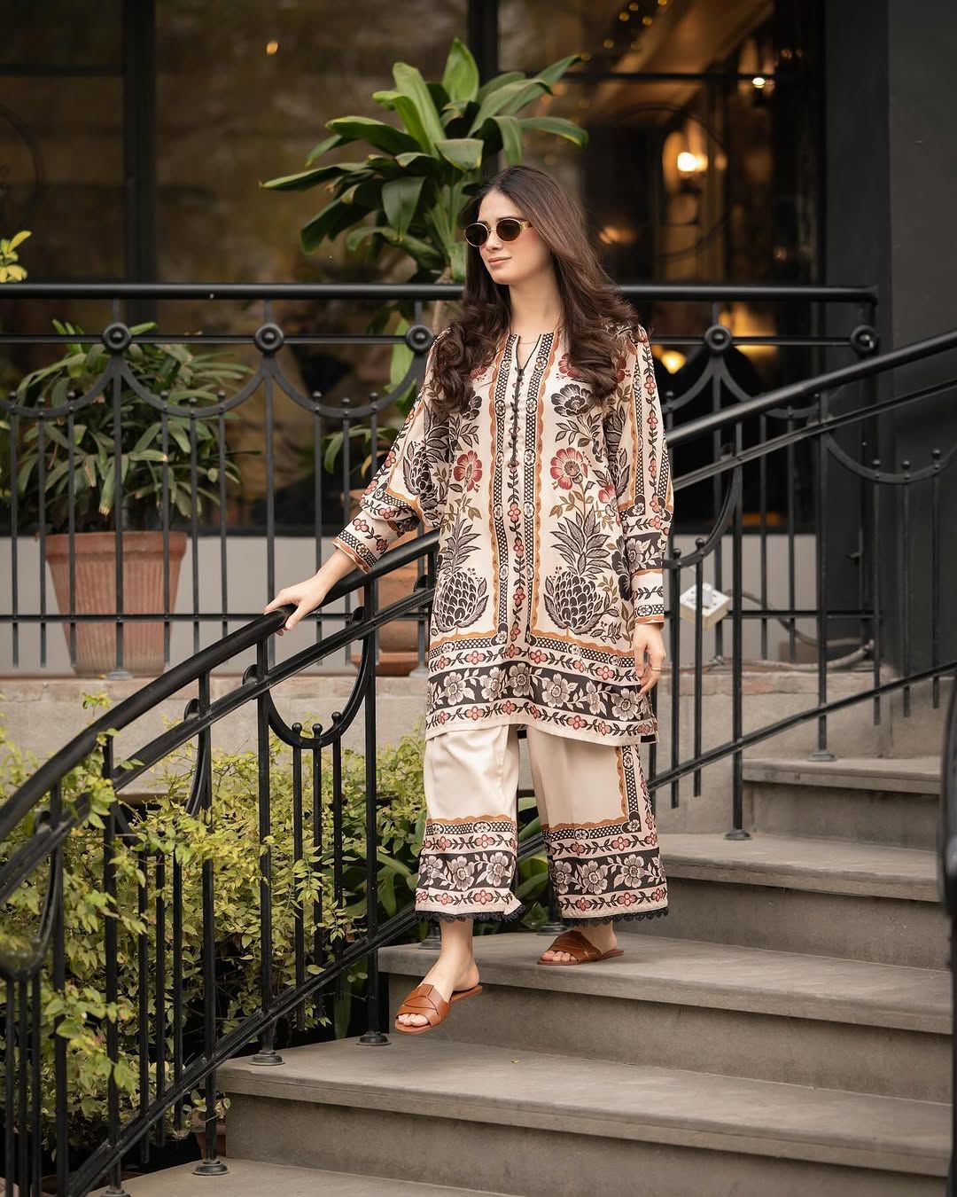 Printed long kurta with patterned border and cream straight pants