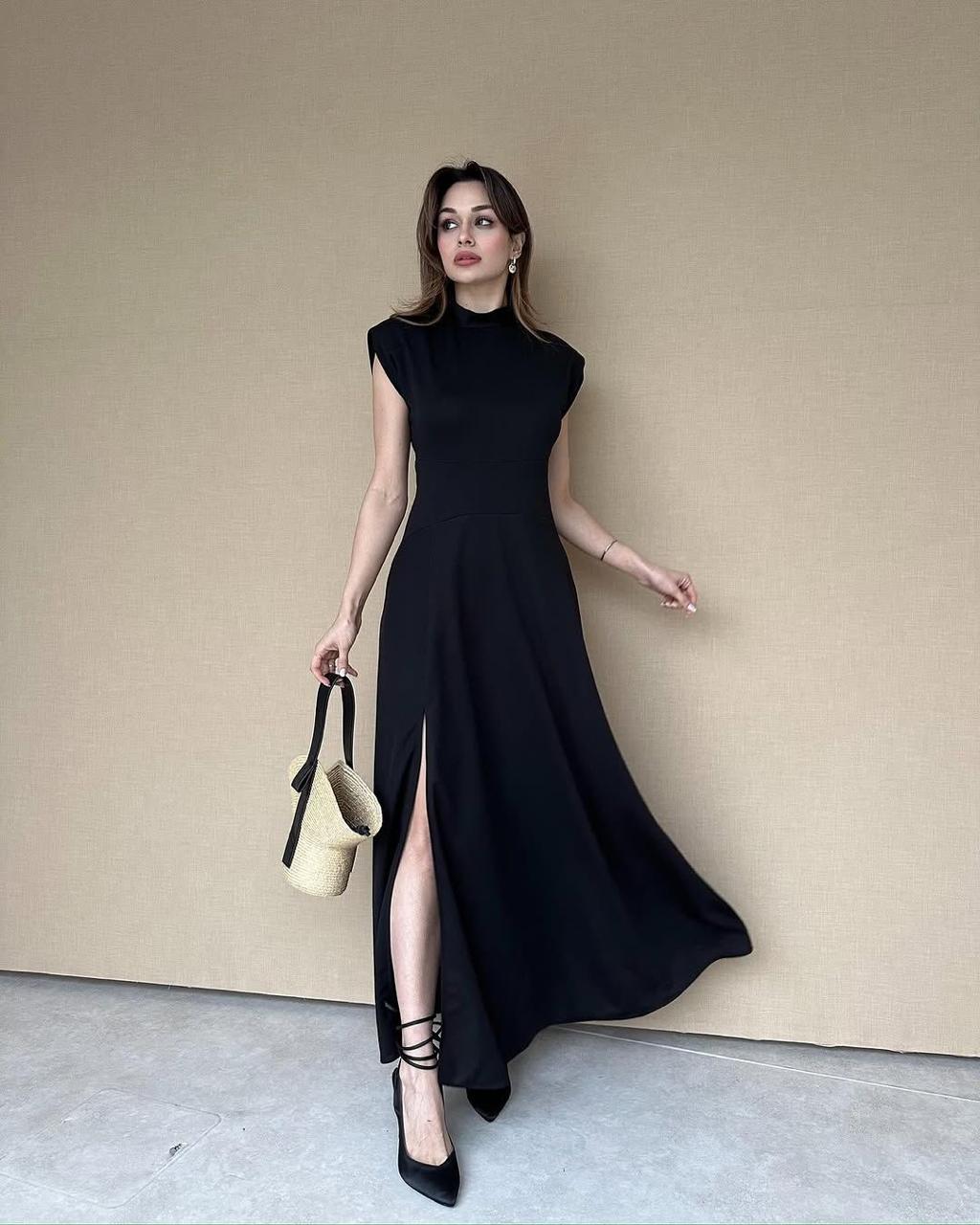 Sleeveless long top dress in black, high neck with side slit and flowy A-line skirt