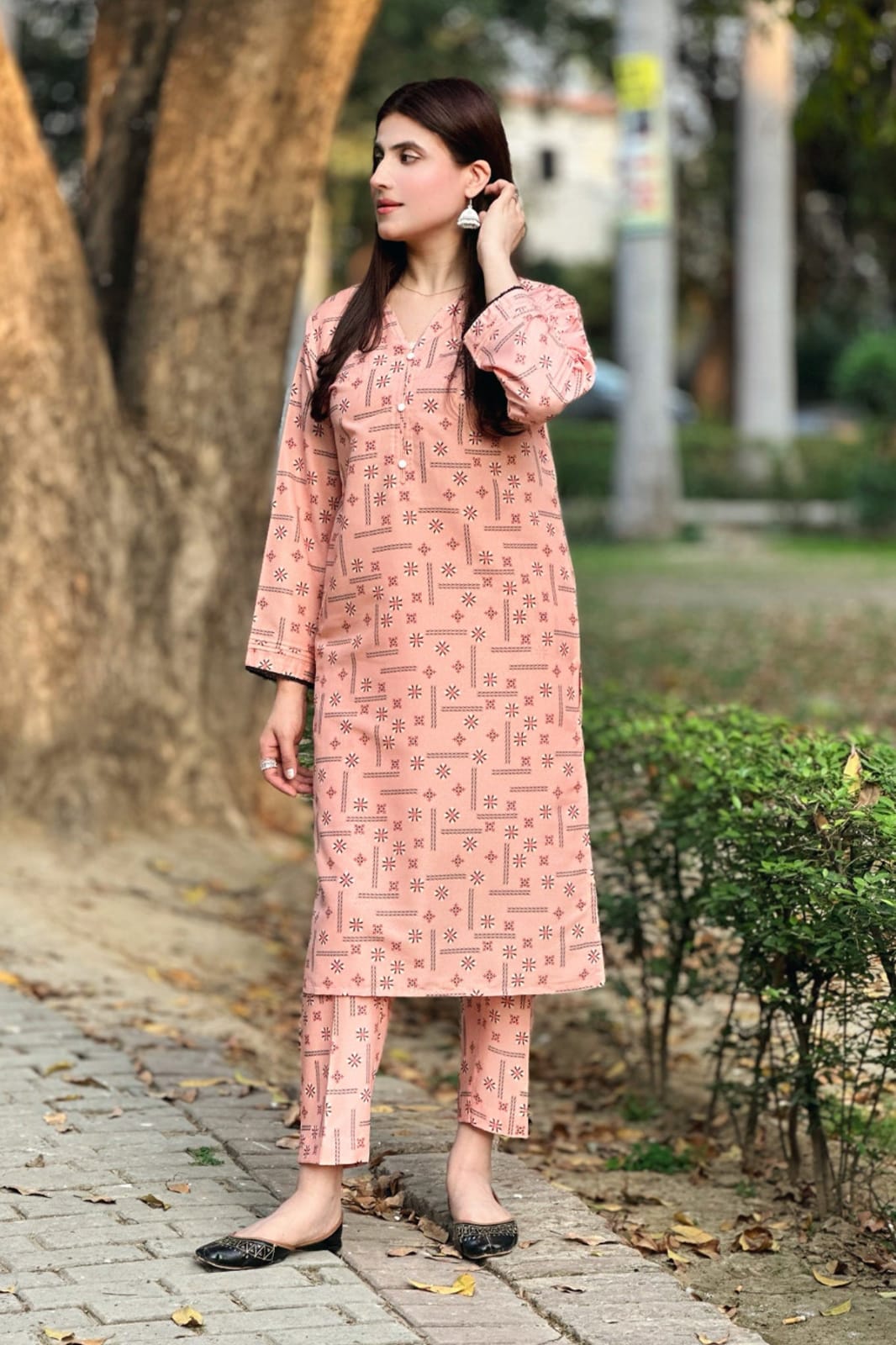 Blush pink 2-piece printed kurta and pants set, side view with long tunic and slim pants